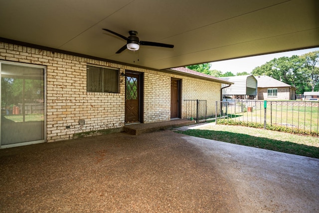 view of patio / terrace featuring ceiling fan and fence