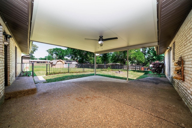 view of patio with fence and a ceiling fan