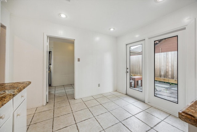 unfurnished room with light tile patterned floors and recessed lighting