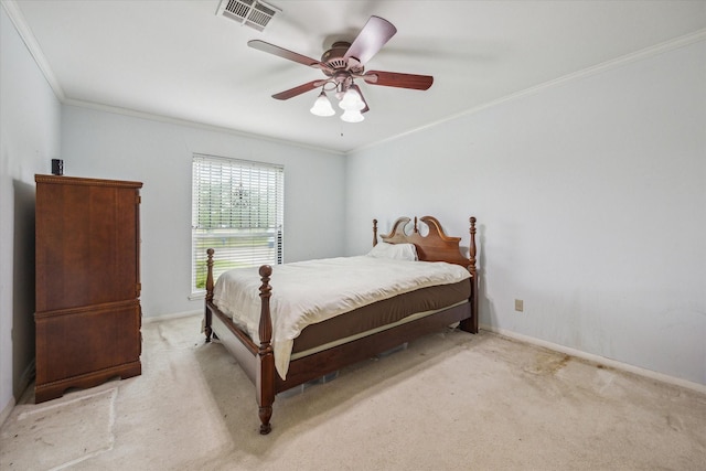 carpeted bedroom featuring visible vents, ornamental molding, baseboards, and a ceiling fan