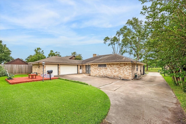 ranch-style house featuring a garage, fence, a front yard, a chimney, and driveway