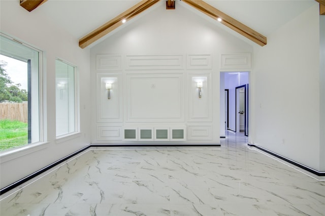 712 Sealy St, Clute, TX 77531 - unfurnished room featuring a healthy amount of sunlight, high vaulted ceiling, beamed ceiling, and marble finish floor