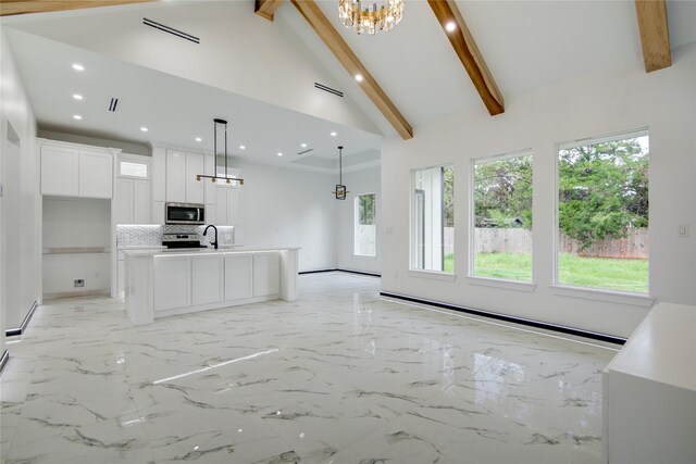 712 Sealy St, Clute, TX 77531 - unfurnished living room with a sink, beamed ceiling, and recessed lighting