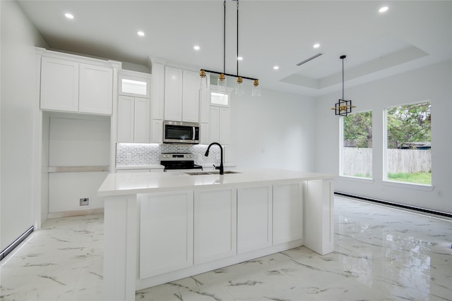 712 Sealy St, Clute, TX 77531 - kitchen featuring stainless steel appliances, recessed lighting, a sink, and marble finish floor