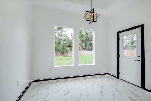 712 Sealy St, Clute, TX 77531 - doorway with an inviting chandelier, plenty of natural light, and marble finish floor