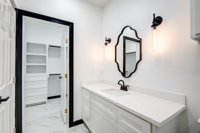 712 Sealy St, Clute, TX 77531 - bathroom featuring vanity, marble finish floor, and baseboards