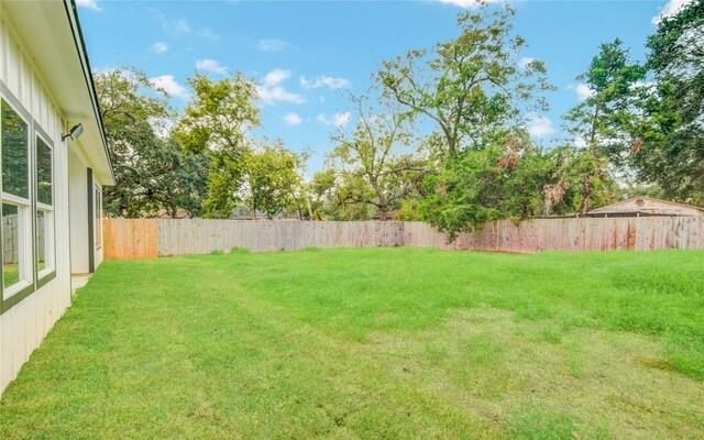 712 Sealy St, Clute, TX 77531 - view of yard with a fenced backyard