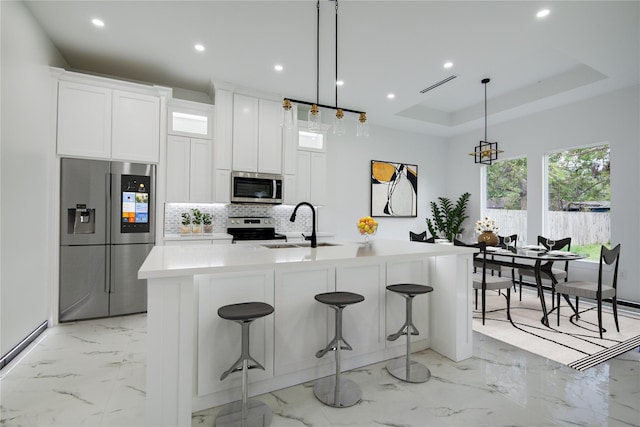 712 Sealy St, Clute, TX 77531 - kitchen featuring stainless steel appliances, recessed lighting, a sink, and marble finish floor