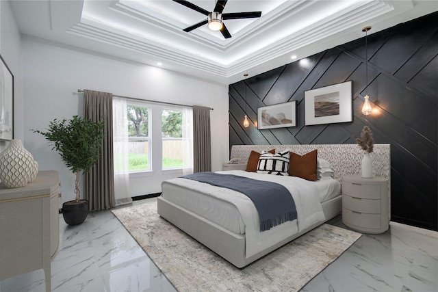 712 Sealy St, Clute, TX 77531 - bedroom with an accent wall, a tray ceiling, recessed lighting, and marble finish floor