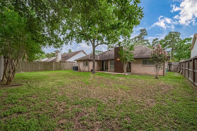 2502 Knollbrook Ln, Spring, TX 77373 - view of yard with cooling unit, a fenced backyard, and a patio area