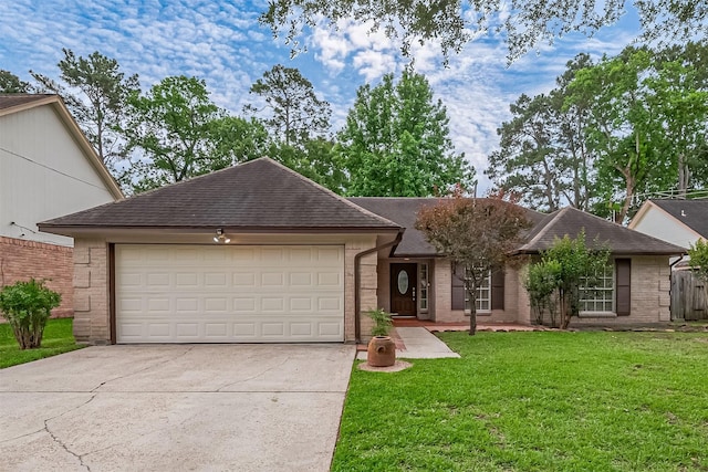2502 Knollbrook Ln, Spring, TX 77373 - ranch-style house with roof with shingles, an attached garage, a front lawn, brick siding, and concrete driveway