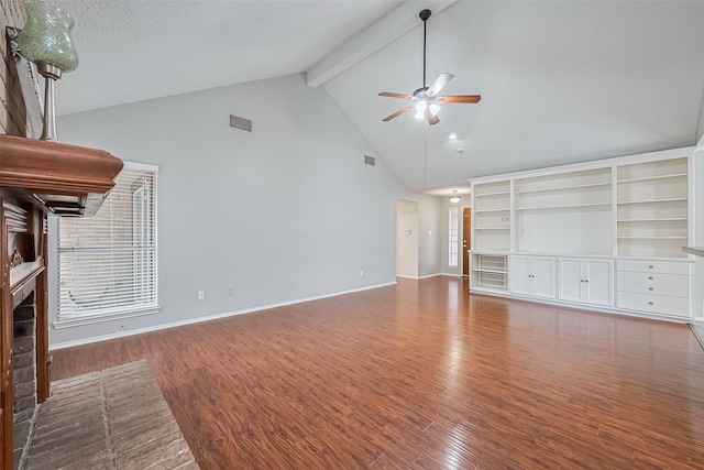 2502 Knollbrook Ln, Spring, TX 77373 - unfurnished living room featuring a ceiling fan, a fireplace, wood finished floors, high vaulted ceiling, and beamed ceiling