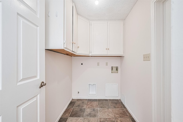 2502 Knollbrook Ln, Spring, TX 77373 - washroom with cabinet space, hookup for a washing machine, a textured ceiling, baseboards, and hookup for an electric dryer