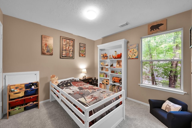 bedroom featuring baseboards, visible vents, multiple windows, and carpet