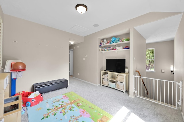 recreation room with baseboards and carpet