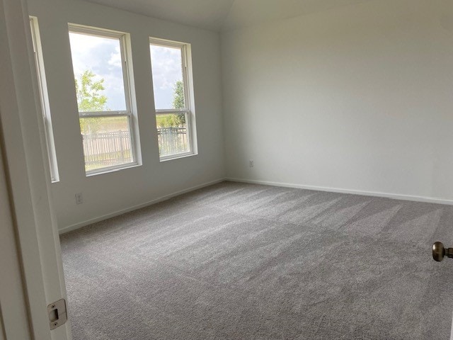 3049 Harrier Dr, Katy, TX 77493 - carpeted empty room with baseboards and lofted ceiling