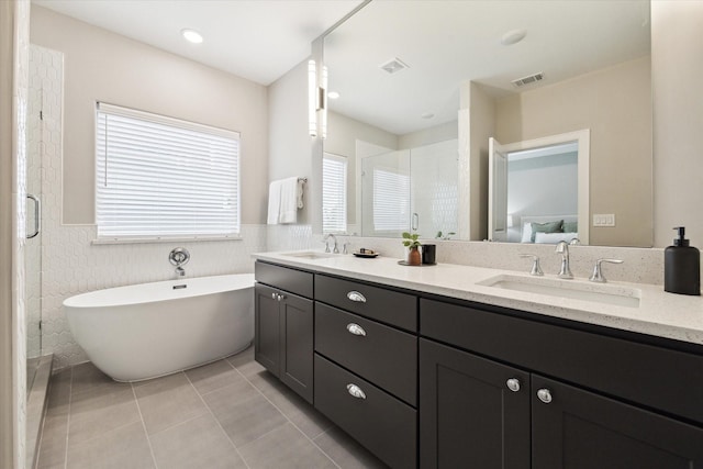 full bathroom featuring visible vents, a sink, ensuite bath, and a shower stall