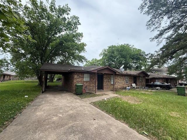 ranch-style home featuring brick siding, a front lawn, driveway, and an attached carport