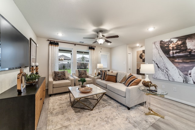 living room with light wood-style floors, a ceiling fan, recessed lighting, and visible vents
