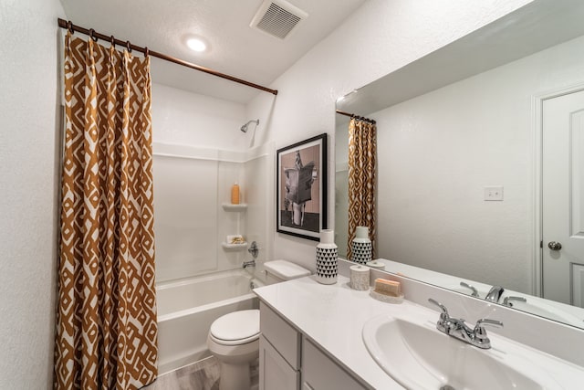 bathroom with visible vents, shower / bath combo with shower curtain, vanity, wood finished floors, and toilet