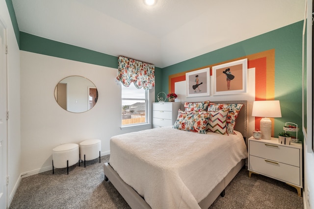 bedroom with baseboards and dark carpet