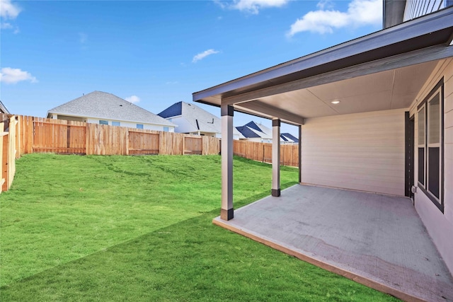 view of yard with a patio and a fenced backyard