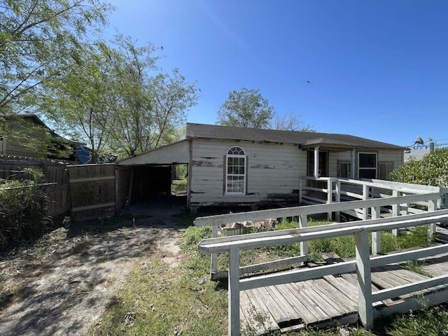 1017 W Buchanan St, Harlingen, TX 78550 - exterior space with fence and a wooden deck