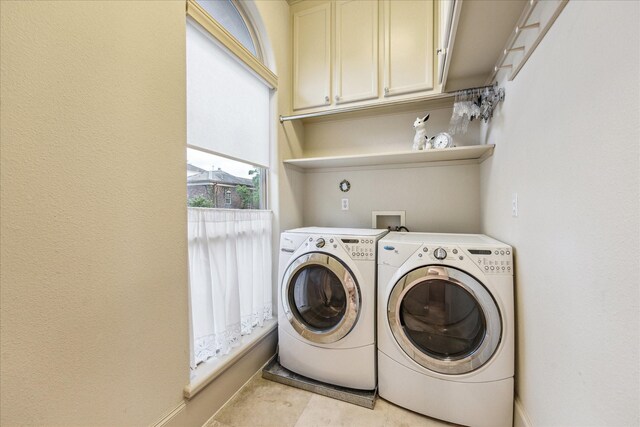 laundry area featuring cabinet space and washer and dryer