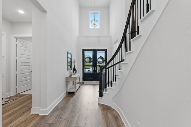 9726 Dani Lake Dr, Tomball, TX 77375 - foyer with baseboards, wood finished floors, stairway, and a high ceiling