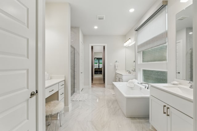 9726 Dani Lake Dr, Tomball, TX 77375 - bathroom featuring marble tiled flooring, a shower stall, a freestanding tub, two vanities, and recessed lighting