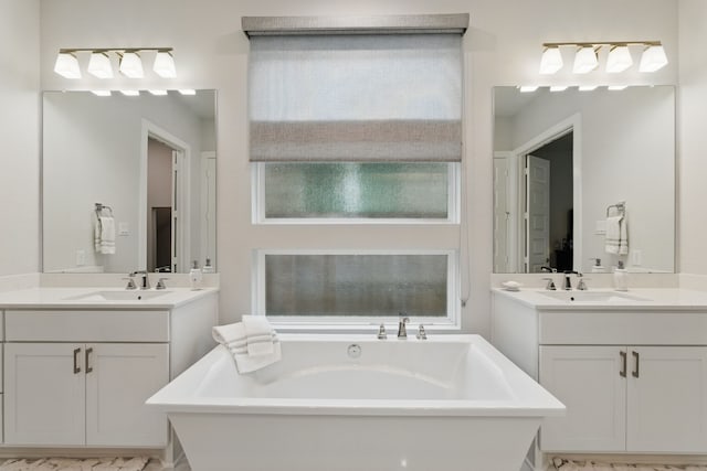 9726 Dani Lake Dr, Tomball, TX 77375 - full bathroom with a freestanding bath and two vanities
