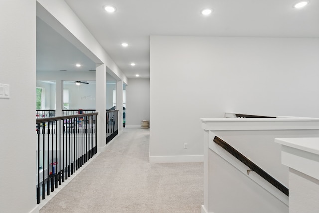 9726 Dani Lake Dr, Tomball, TX 77375 - hallway featuring recessed lighting, light carpet, an upstairs landing, and baseboards