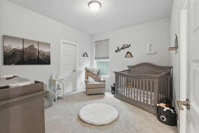 9726 Dani Lake Dr, Tomball, TX 77375 - carpeted bedroom with a crib and baseboards