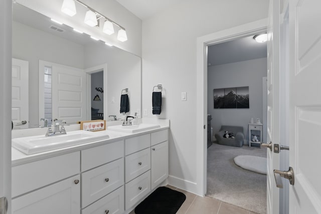 9726 Dani Lake Dr, Tomball, TX 77375 - bathroom featuring tile patterned floors, double vanity, and baseboards