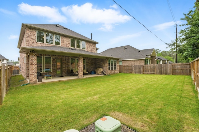 9726 Dani Lake Dr, Tomball, TX 77375 - rear view of house featuring brick siding and a patio