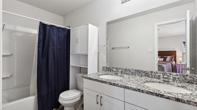 15515 Taylorcrest Dr, Conroe, TX 77306 - ensuite bathroom featuring toilet, double vanity, and shower / bath combination with curtain