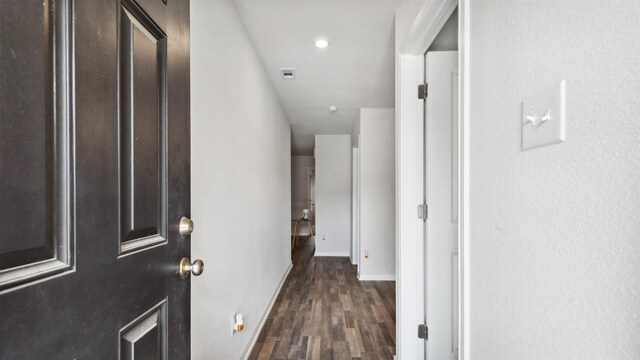15515 Taylorcrest Dr, Conroe, TX 77306 - corridor featuring dark wood finished floors and baseboards