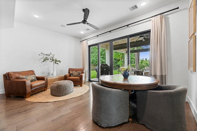 dining space featuring visible vents, a ceiling fan, wood finished floors, and recessed lighting