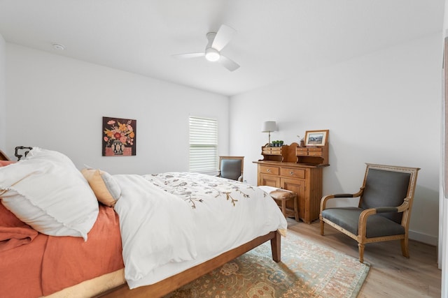 bedroom featuring light wood-type flooring and a ceiling fan