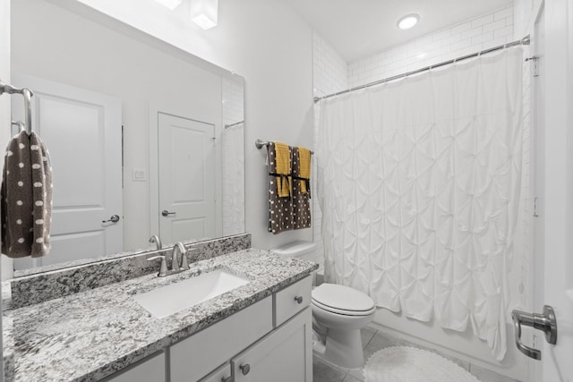 bathroom with vanity, shower / bath combo with shower curtain, toilet, recessed lighting, and tile patterned floors