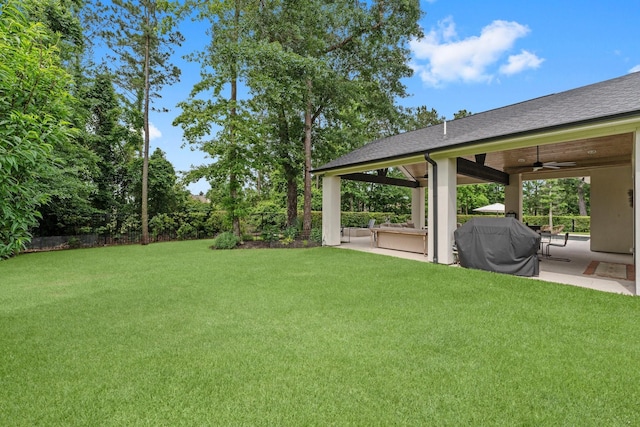 view of yard with a gazebo, ceiling fan, and a patio area