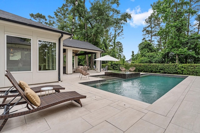 view of swimming pool featuring a fenced in pool and a patio area
