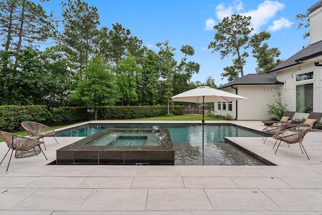 view of swimming pool featuring a fenced in pool, fence, a patio, and an in ground hot tub