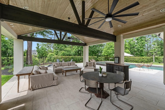 view of patio / terrace featuring ceiling fan, a gazebo, fence, a fenced in pool, and outdoor lounge area