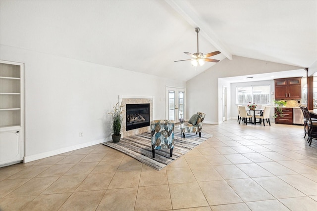 living area featuring light tile patterned floors, ceiling fan, a fireplace, and a wealth of natural light