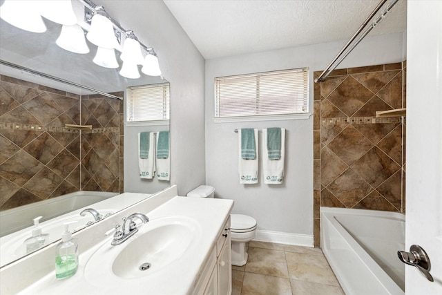bathroom featuring vanity, tile patterned floors, bathtub / shower combination, and toilet