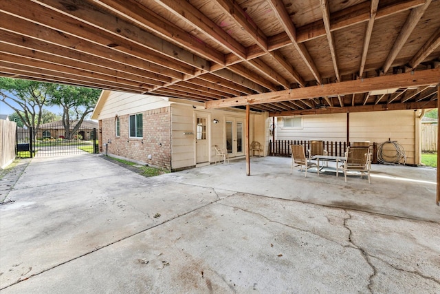 view of patio / terrace featuring french doors and fence