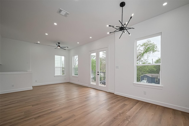 unfurnished living room with visible vents, recessed lighting, light wood-style flooring, and baseboards