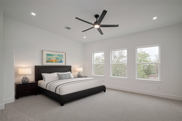 bedroom featuring recessed lighting, baseboards, visible vents, and light carpet