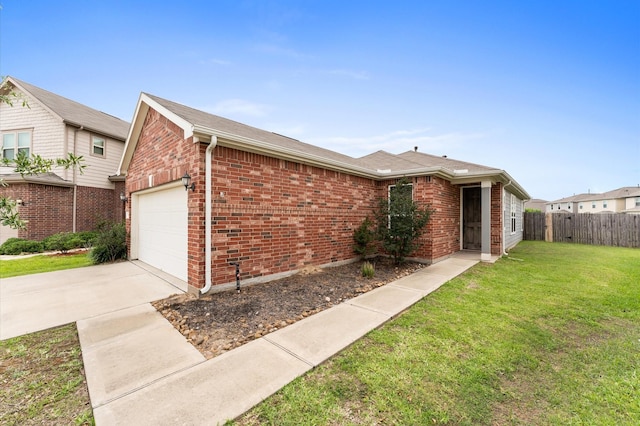 ranch-style home featuring a front lawn, fence, brick siding, an attached garage, and driveway